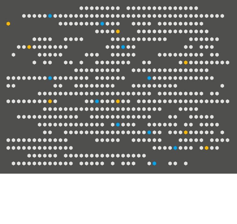 White, blue and yellow dots against a grey background.